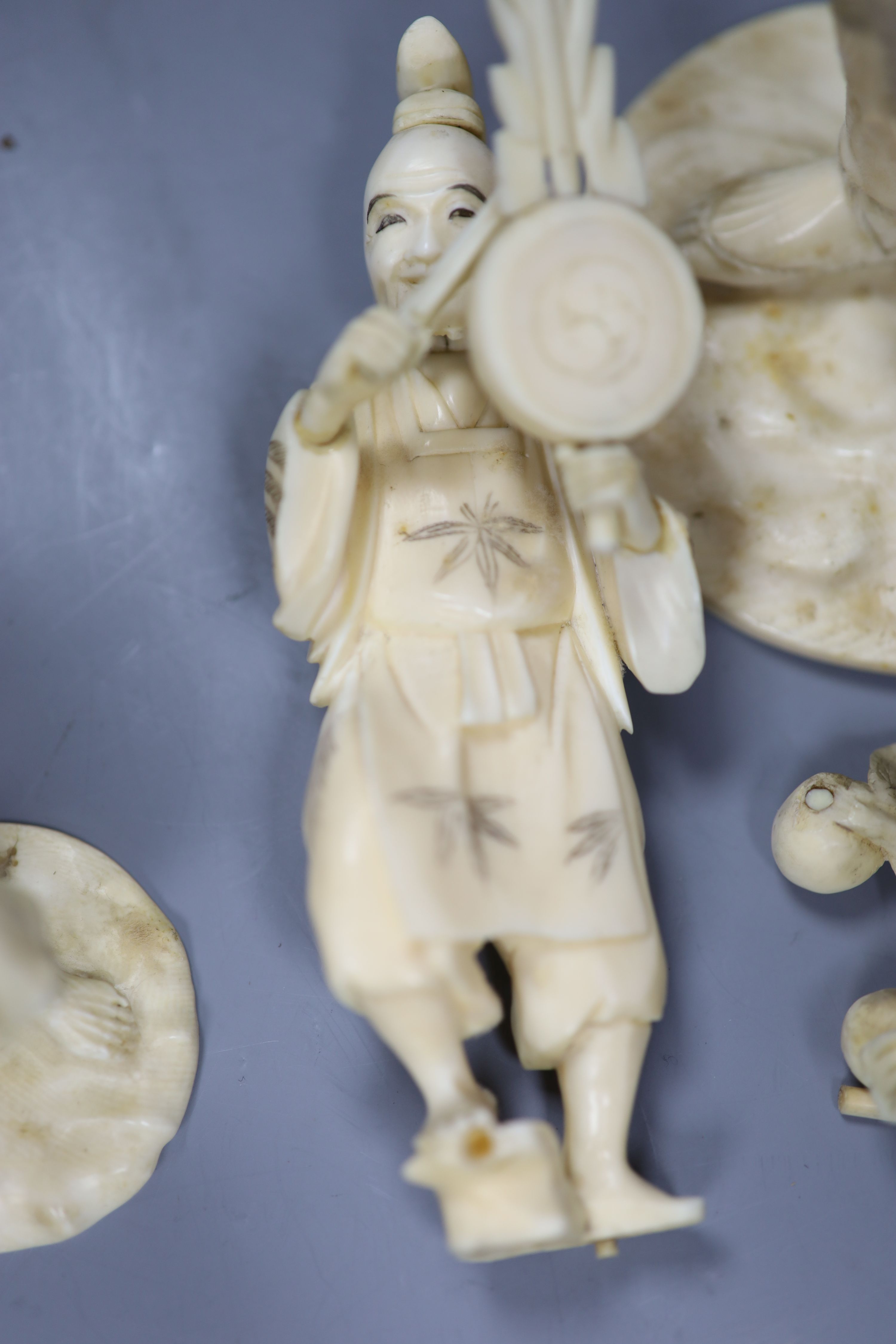 Four 19th century Japanese carved ivory figures, tallest 21cm
